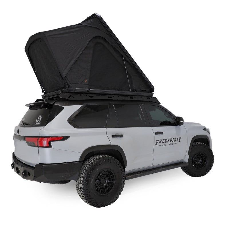 freespirit-recreation-aspen-v2-hard-shell-roof-top-tent-black-open-side-view-on-top-toyota-sequoia-on-white-backgroud