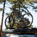 freespirit-recreation-aspen-v2-xl-hard-shell-roof-top-tent-black-closed-on-top-of-vehicle-with-bike-in-nature