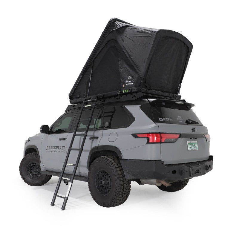 freespirit-recreation-aspen-v2-xl-hard-shell-roof-top-tent-black-open-side-view-on-top-toyota-sequoia-with-ladder-on-white-background