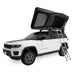 freespirit-recreation-odyssey-black-hard-shell-roof-top-tent-open-front-corner-view-on-jeep-grand-cherokee-aluminum-ladder-on-white-background