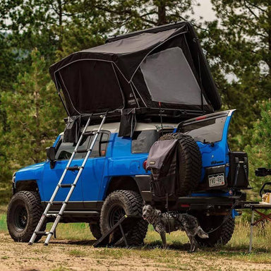 freespirit-recreation-odyssey-black-hard-shell-roof-top-tent-open-rear-corner-view-on-toyota-fj-in-nature
