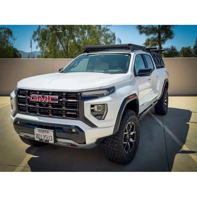 leitner-acs-roof-over-cab-platform-rack-for-2023-chevrolet-colorado-front-view-in-parking-lot