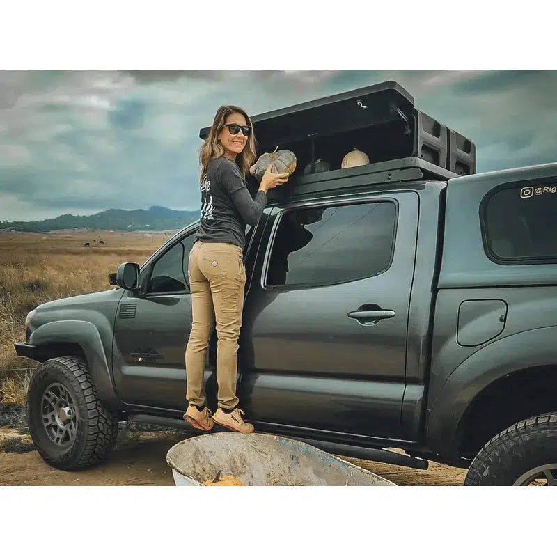 leitner-gearpod-roof-for-acs-roof-platform-rack-front-corner-view-on-toyota-tacoma-with-person-in-nature