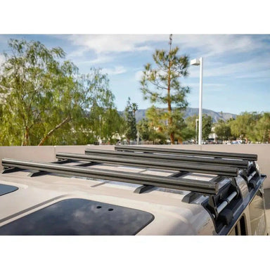 leitner-ineos-grenadier-2024-load-bar-kit-single-bar-front-corner-view-on-vehicle-in-nature