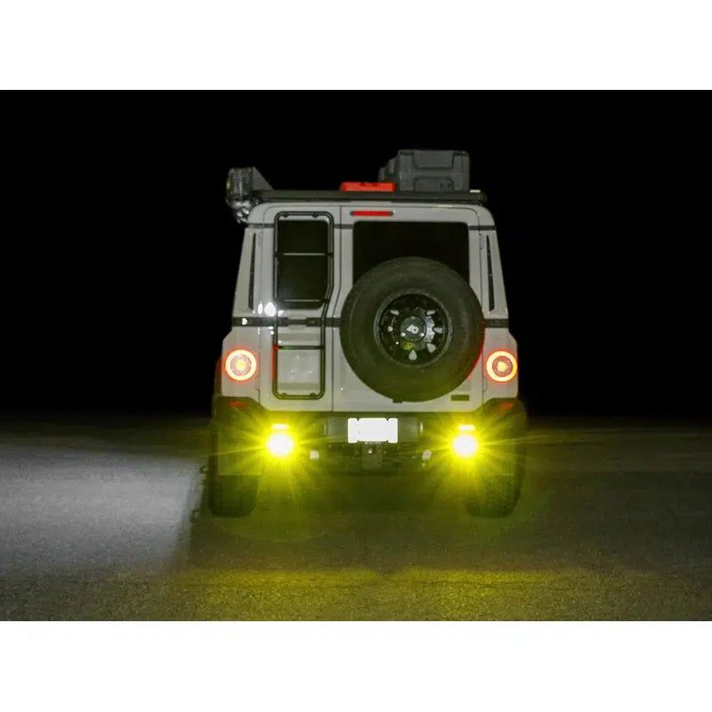 leitner-ineos-grenadier-chase-light-bracket-rear-view-with-chase-lights-on-vehicle-on-the-road