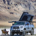 overland-vehicle-systems-discovery-rack-front-corne-view-on-toyota-tundra-with-roof-top-tent-and-awning-at-campsite