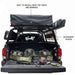 overland-vehicle-systems-discovery-rack-full-size-truck-short-bed-rear-view-on-vehicle-with-accessory-plates-on-white-background