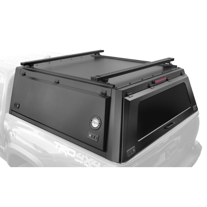 overland-vehicle-systems-expedition-truck-cap-2023-2024-colorado-canyon-black-close-with-crossbars-rear-corner-view-on-white-background