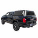 overland-vehicle-systems-expedition-truck-cap-black-for-2023-2024_-colorado-canyon-rear-corner-view-on-neutral-background