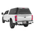 overland-vehicle-systems-expedition-truck-cap-black-for-2023-2024-ford-f250-f350-rear-corner-view-on-natural-backgound