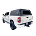 overland-vehicle-systems-expedition-truck-cap-for-2007-toyota-tundra-black-closed-rear-corner-view-on-white-background