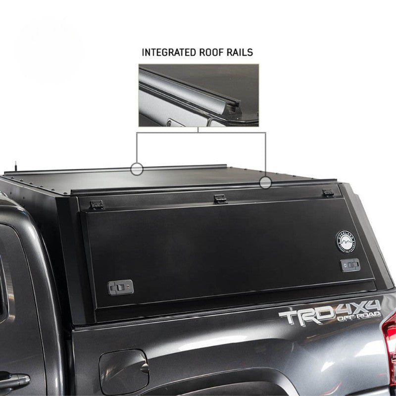 overland-vehicle-systems-expedition-truck-cap-for-2017-2022-ford-f-250-350-black-side-view-closed-doors-roof-rails-on-white-background