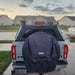 overland-vehicle-systems-expedition-truck-cap-for-ford-ranger-black-rear-view-on-truck-in-driveway