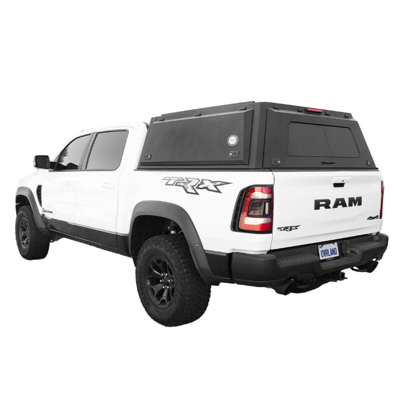 overland-vehicle-systems-expedition-truck-cap-for-ram-1500-black-closed-rear-corner-view-on-natural-background