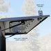 overland-vehicle-systems-expedition-truck-cap-for-ram-1500-black-open-close-up-view-with-description-in-nature