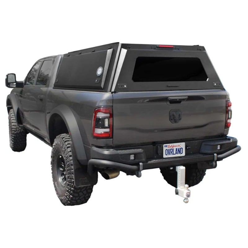 overland-vehicle-systems-expedition-truck-cap-for-ram-2500-and-3500-black-closed-rear-corner-view-on-natural-background