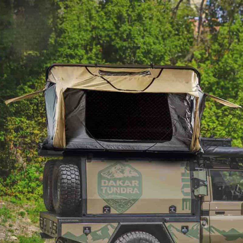 overland-vehicle-systems-hd-bundu-hard-shell-roof-top-tent-gray-body-green-rainfly-open-front-view-on-vehicle-in-nature