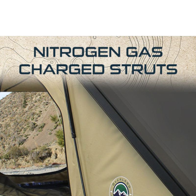 overland-vehicle-systems-ld-tmon-clamshell-aluminum-hard-shell-roof-top-tent-tan-open-close-up-view-with-gas-struts-in-nature