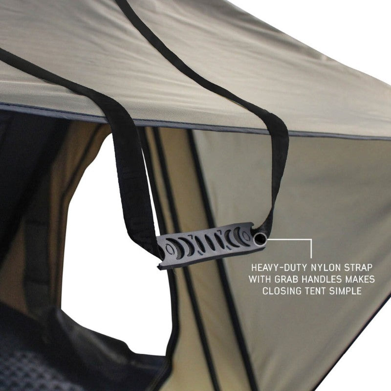 overland-vehicle-systems-ld-tmon-clamshell-aluminum-hard-shell-roof-top-tent-tan-open-close-up-view-with-heavy-duty-nylon-strap-on-white-background