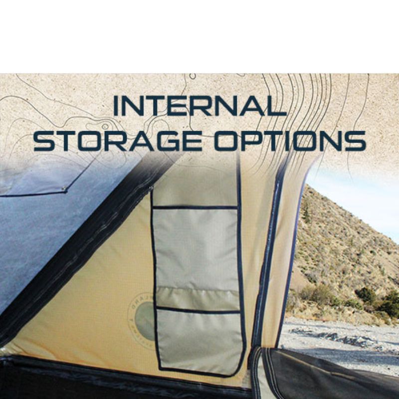 overland-vehicle-systems-ld-tmon-clamshell-aluminum-hard-shell-roof-top-tent-tan-open-interior-view-with-internal-storage-options-in-nature