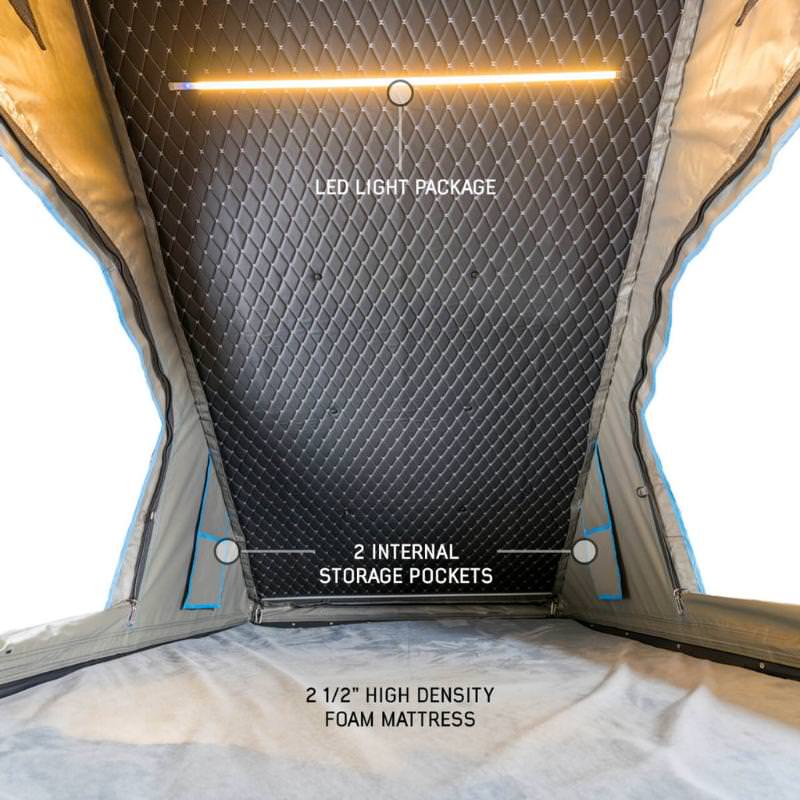 overland-vehicle-systems-magpak-camper-shell-roof-top-tent-for-ford-f-150-open-interior-view-led-light-package-on-white-background