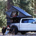 overland-vehicle-systems-magpak-camper-shell-roof-top-tent-for-ford-ranger-open-side-view-on-vehicle-with-people-in-terrain