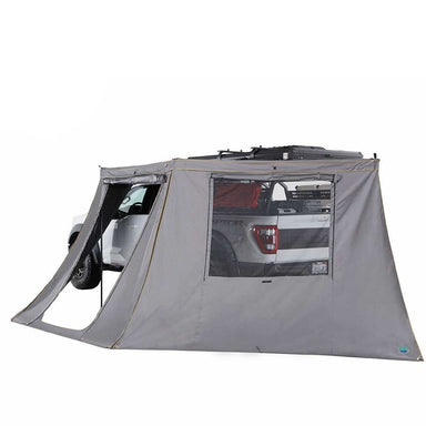 overland-vehicle-systems-nomadic-180-lte-awning-wall-with-windows-open-rear-corner-view-on-vehicle-with-door-on-white-background