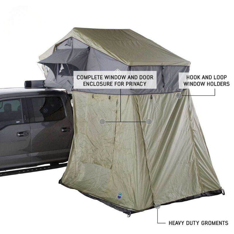 overland-vehicle-systems-nomadic-annex-fitted-to-nomadic-extended-soft-shell-roof-top-tent-gray-tent-green-annex-open-front-corner-view-with-enclosure