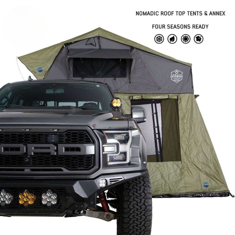 overland-vehicle-systems-nomadic-annex-fitted-to-nomadic-extended-soft-shell-roof-top-tent-gray-tent-green-annex-open-side-view-on-ford-vahicle
