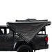 overland-vehicle-systems-nomadic-awning-270-driver-side-gray-semi-closed-and-folded-side-view-on-toyota-tacoma