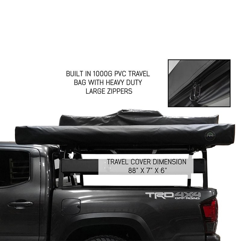 overland-vehicle-systems-nomadic-awning-270-for-mid-high-roofline-vans-driver-side-closed-side-view-on-toyota-tacoma-on-white-background-with-travel-cover-dimensions