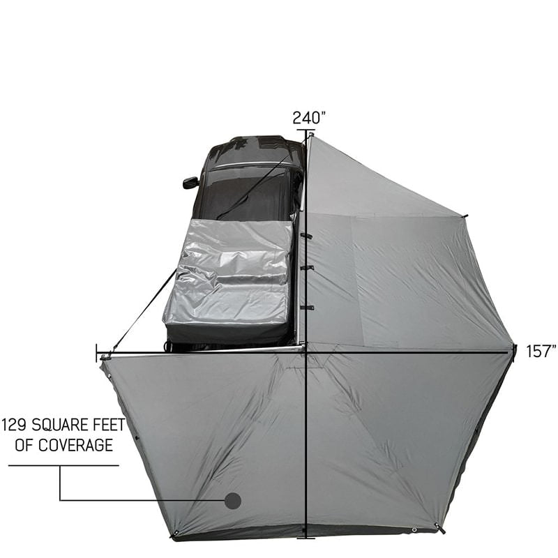 overland-vehicle-systems-nomadic-awning-270-for-mid-high-roofline-vans-passenger-side-open-drone-view-on-toyota-tacoma-with-dimensions-on-white-background
