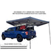 overland-vehicle-systems-nomadic-awning-270-lt-driver-side-dark-gray-open-rear-view-on-ford-ranger-with-expanding-poles-description