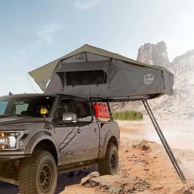 overland-vehicle-systems-nomadic-extended-soft-shell-roof-top-tent-grey-open-side-view-on-ford-in-terrain