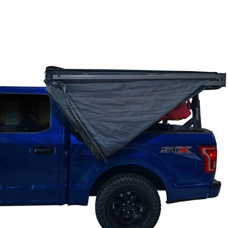 overland-vehicle-systems-nomadic-lt-270-awning-with-walls-dark-gray-driver-side-semi-open-side-view-on-ford-ranger-on-white-background