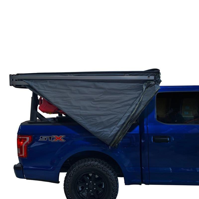 overland-vehicle-systems-nomadic-lt-270-awning-with-walls-dark-gray-passenger-side-semi-open-side-view-on-ford-ranger-on-white-background