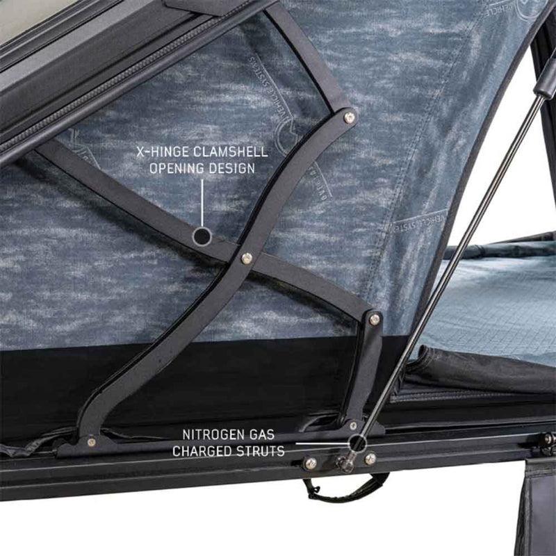 overland-vehicle-systems-xd-lhotse-hard-shell-roof-top-tent-open-close-up-view-with-x-hinge-clamshell-opening-design-on-white-background