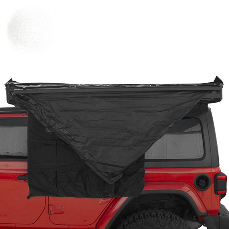 overland-vehicle-systems-xd-nomadic-180-awning-with-lights-and-black-out-closed-front-view-on-vehicle-on-white-background