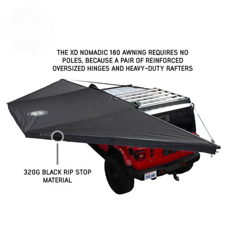 overland-vehicle-systems-xd-nomadic-180-awning-with-lights-and-black-out-open-drone-view-with-rip-stop-fabric-on-white-background