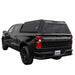 ovs-expedition-truck-cap-for-chevrolet-silverado-1500-black-rear-view-on-chevy-silverado-on-white-background