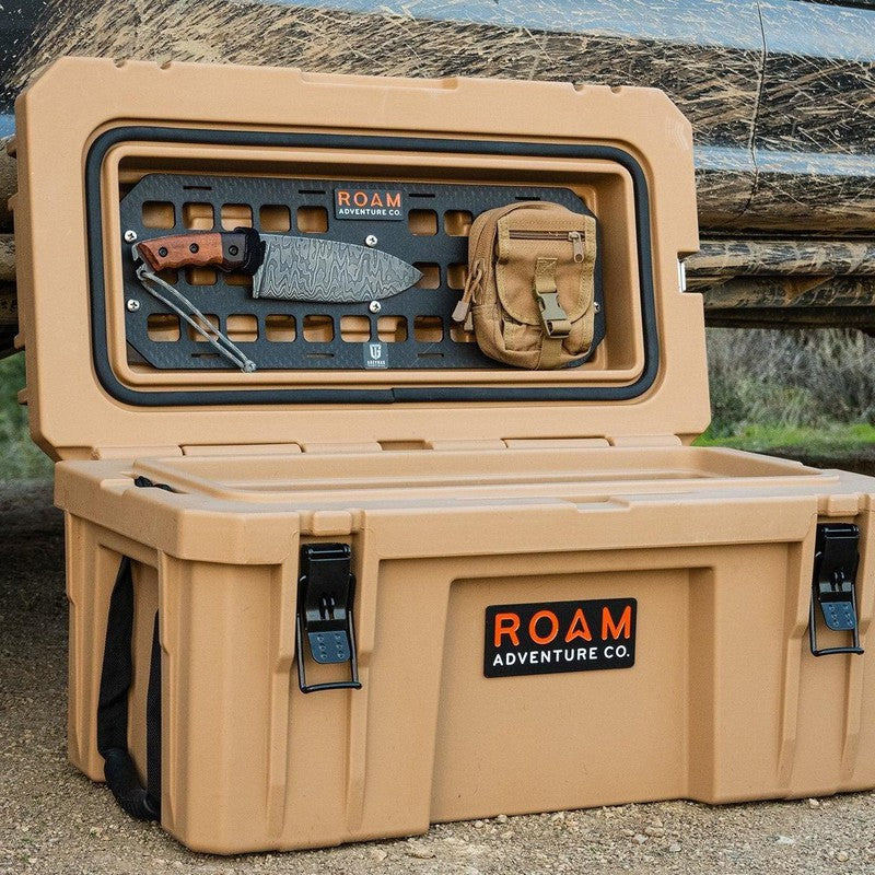 roam-105l-rugged-case-molle-panel-front-corner-view-on-rugged-case-on-the-ground