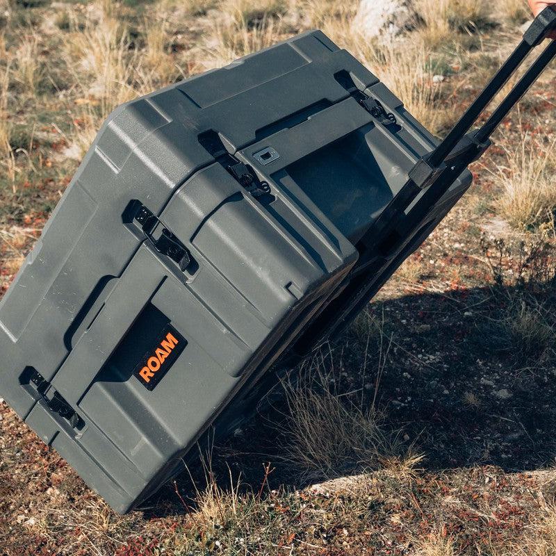 roam-132l-rolling-rugged-case-slate-front-corner-view-with-handle-in-nature