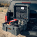 roam-132l-rolling-rugged-case-slate-open-front-corner-view-on-vehicle-in-nature