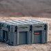 roam-150l-rolling-rugged-case-slate-frotn-corner-view-on-desert