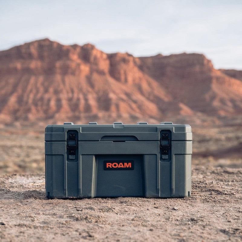 roam-76l-rugged-case-slate-front-view-in-terrain