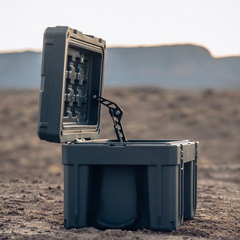 roam-76l-rugged-case-slate-open-side-view-in-terrain