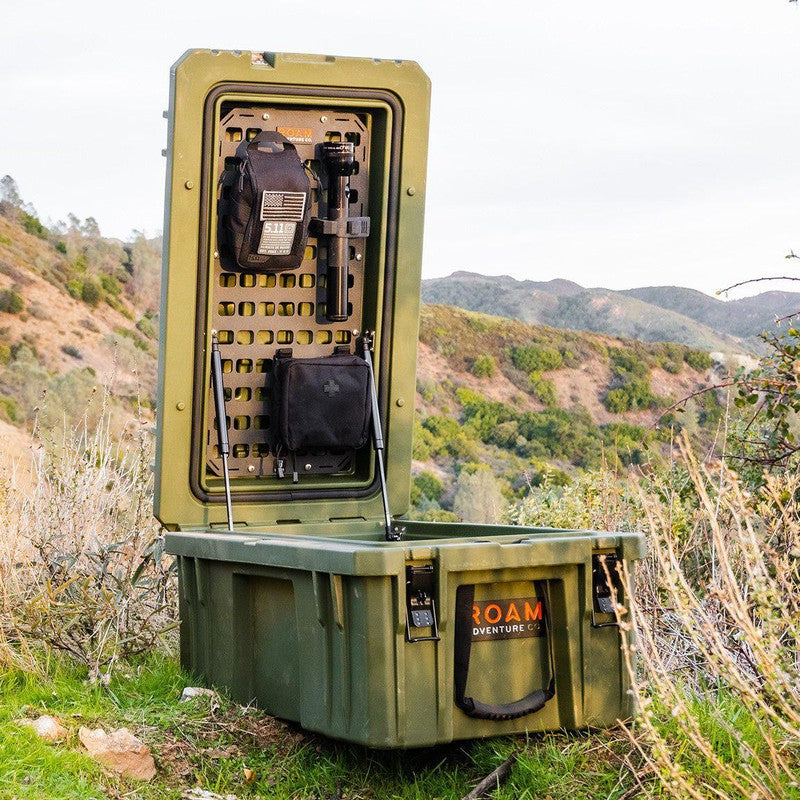 roam-95l-rugged-case-molle-panel-front-corner-view-in-rugged-case-on-mountain