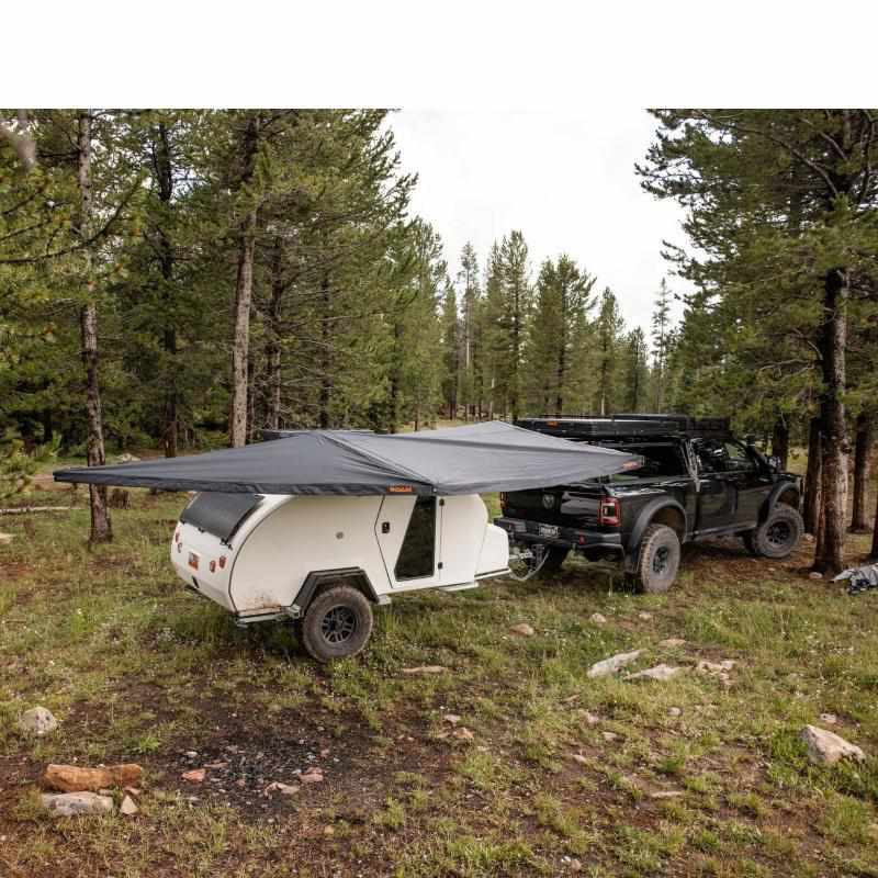 roam-arc-180-awning-rear-corner-view-on-trailer-in-forest