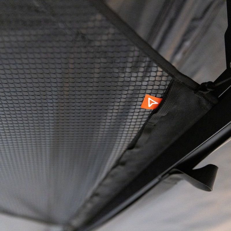 roam-arc-270-overhead-mesh-storage-close-up-view-with-brand-logo