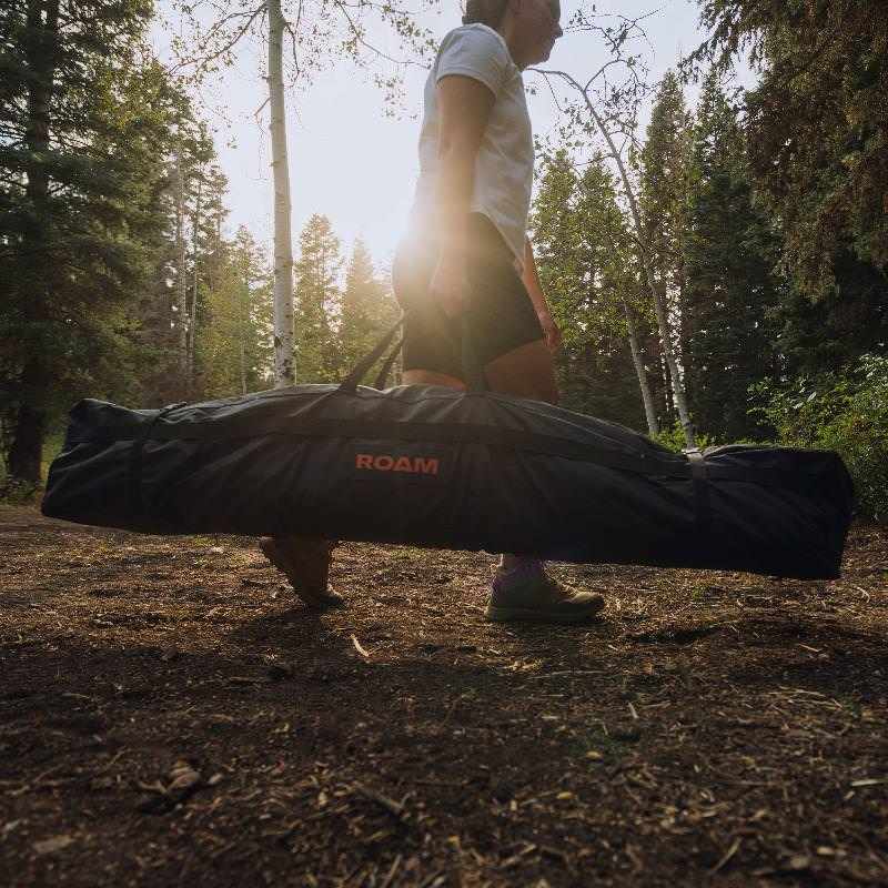 roam-drifter-tent-closed-front-view-with-person-in-nature